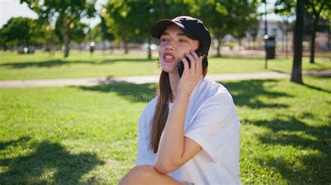 Calling Woman Sitting Grass Urban Park Closeup Relaxed Brunette Talking Phone Stock Photo