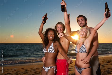 People having party at beach with drinks Stock Photo | Adobe Stock