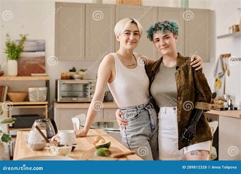 Lesbian Couple Preparing Food In The Kitchen Stock Photo Image Of Prosthesis Indoors