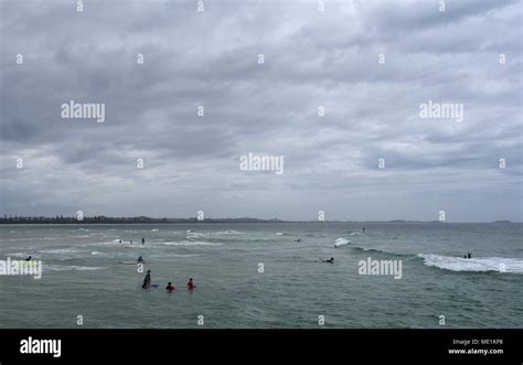 People Surfing On Kingscliff Beach On A Cloudy Day Stock Photo Alamy