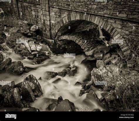 Stream Flowing Under Ancient Stone Arch Bridge Pont Pen Y Benglog