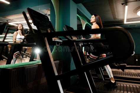 Fit Woman in Sportswear Doing Hard Cardio Workout on Treadmill in the ...