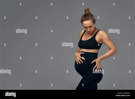 Cute Pregnant Belly Isolated On Gray Side View Of Young Pregnant Woman