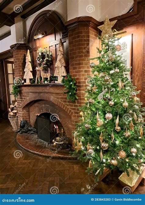 Decorated Christmas Tree in Hotel Lobby by Fireplace Stock Image ...