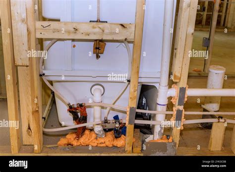 Workers Are Installing Plumbing Connecting Bath Systems Inside