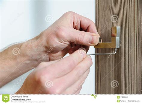 A Man Is Installing A Hook Stock Image Image Of Extinguisher