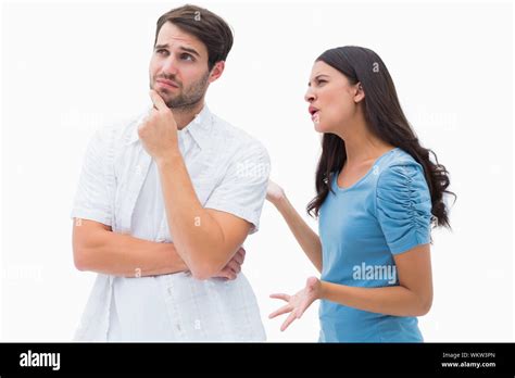 Angry Brunette Shouting At Boyfriend On White Background Stock Photo