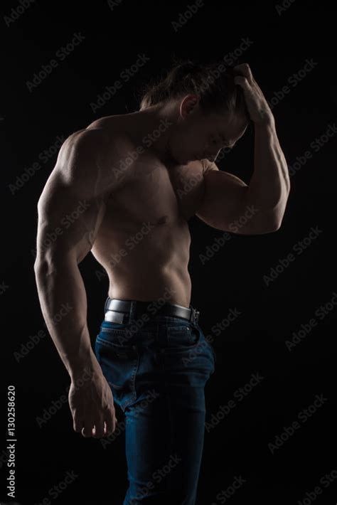 Naked Torso Male Bodybuilder Athlete In The Studio On A Black Background Stock Photo Adobe Stock