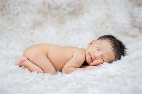 Premium Photo Newborn Baby Sleeping Peacefully Naked