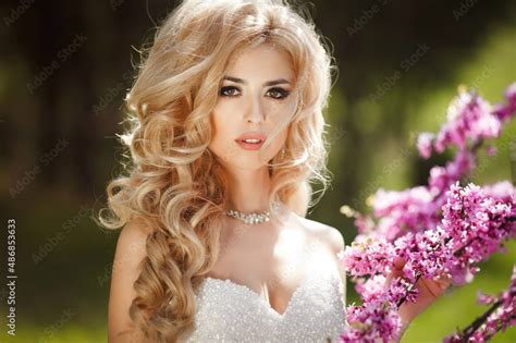 Beautiful Blonde Bride With Cool Makeup And Brown Eyes In A Wedding Dress Wedding Photo