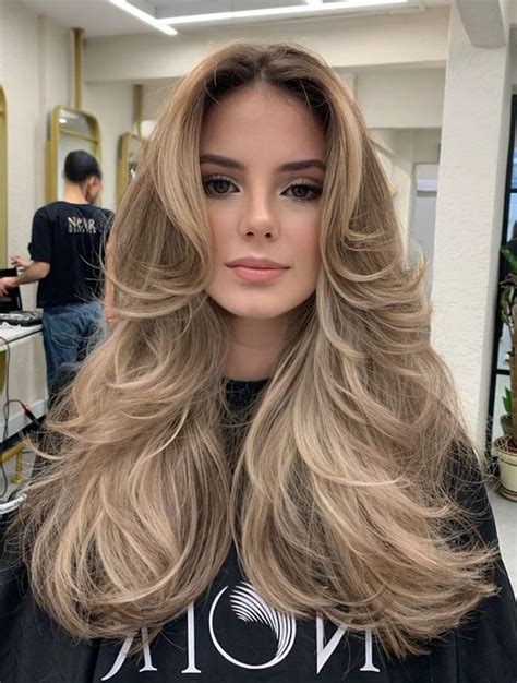 29 Versatile Layered Haircuts That Go Beyond Blonde With Flip Curtain Bangs