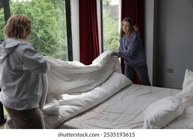 Lesbian Couple Making Bed Home Together Stock Photo 2535193615 Shutterstock