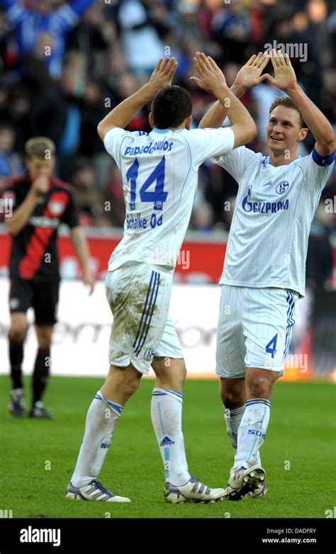 Schalke S Benedikt Hoewedes R And Kyriakos Papadopoulos Celebrate The