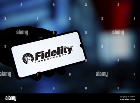 Fidelity investments logo is displayed on smartphone. Fidelity ...