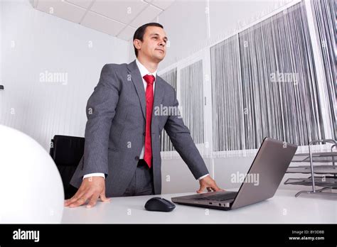Mature Businessman Working At The Office With His Laptop Stock Photo Alamy