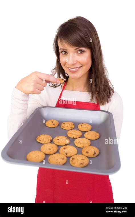 Festive Brunette Showing Hot Cookies On White Background Stock Photo Alamy