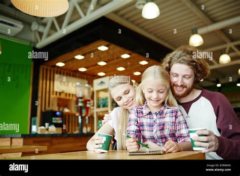 Family in cafe Stock Photo - Alamy
