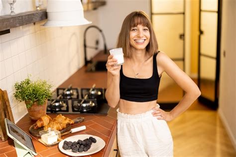 Premium Photo Woman Has A Breakfast On Kitchen At Home