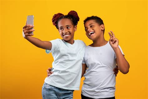 Cute Black Girlfriends Taking Selfie Together On Phone Stock Image Image Of Floor House