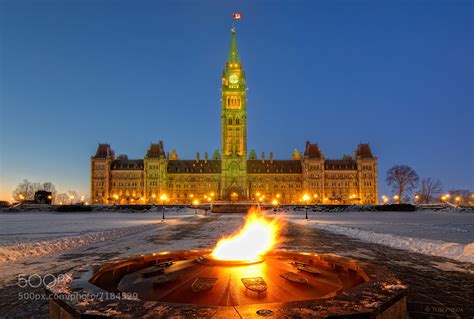 Photograph Parliament Hill & The Centennial Flame in mid-winter by Tom ...