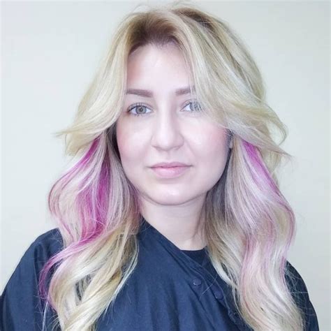 Platinum Blonde Layered Cut With Wavy Texture And Long Curtain Bangs