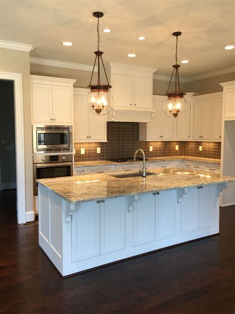 Sherwin Williams Pure White Cabinets with Worldly Gray Walls