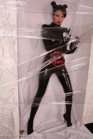 Sexy Brunette In Black Latex Jumpsuit Takes On Red Mask XXX Dessert