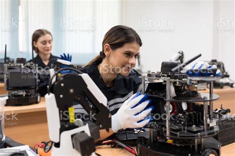 Female Engineers Training Or Maintenance Ai Robot And Artificial