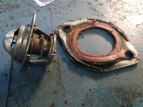 Замена:прокладок ГБЦ, термостата, прокладки впускного коллектора ...