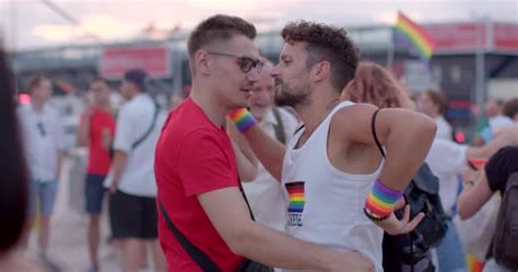 Happy Gay Couple Dancing Joyfully At The Festival Dance Floor Hugging And Spinning Celebration