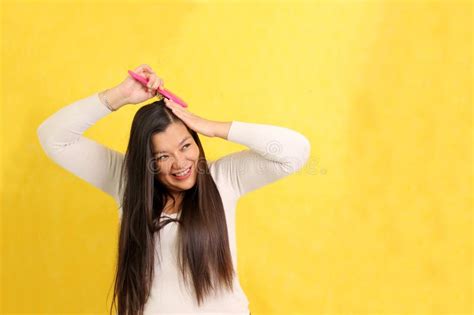 Year Old Latina Woman Cares And Brushes Hair In The Bathroom In A