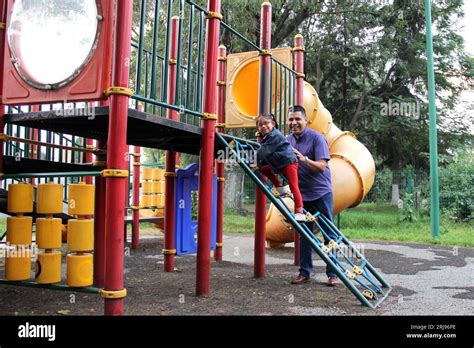 Divorced Single Dad With His Brunette Latina Daughter Play In The Park