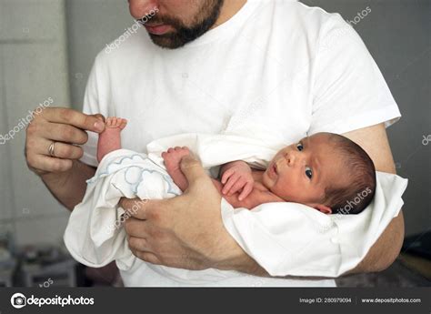 Father Holds Naked Newborn Son In His Hands In A White Diaper Stock Photo Feonita 280979094