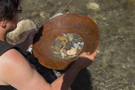 Gold Nugget mining from the River — Stock Photo © Luftklick #113218382