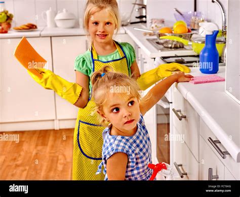 children cleaning kitchen housekeeping  res stock photography