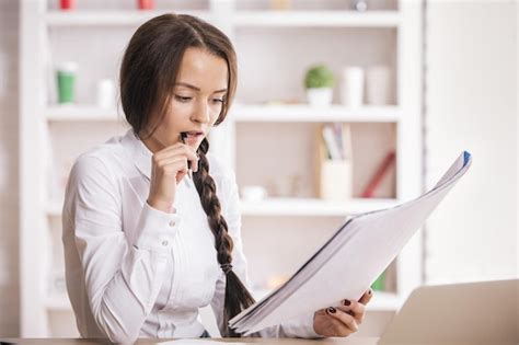 Premium Photo Thoughtful Female Doing Paperwork