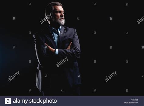 Handsome Mature Business Man Isolated On Black Background Stock Photo