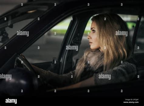 City Portrait Of Pretty Blonde Driver Inside The Car Night Scene Lady Behind The Wheel Soft