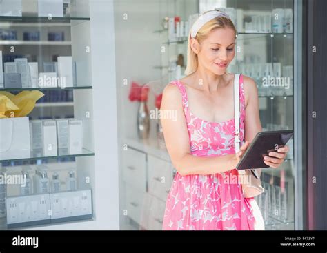 Pretty Blonde Using Her Tablet Pc Stock Photo Alamy