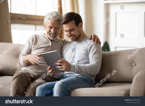 Smiling Mature Father Grownup Son Relax Stock Photo 1890931387 Shutterstock