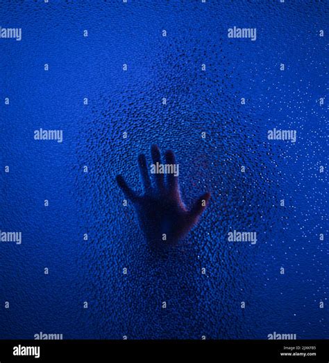 The Shadow Of Human Hand Behind The Glass Stock Photo Alamy
