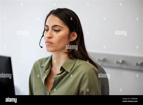 Focused Female Call Center Employee At Work Stock Photo Alamy