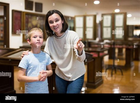 Family visiting historical museum Stock Photo - Alamy