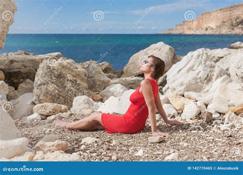 Female Person Resting On Rocky Seashore Stock Image Image Of Autumn