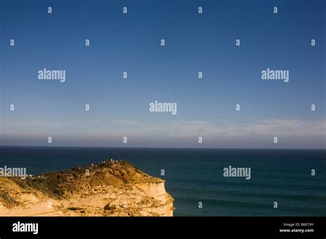 Tourists View The Twelve Apostles Near Port Campbell Along The Great