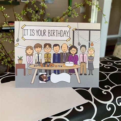 a birthday card with an image of people and a dog sitting at a table in ...