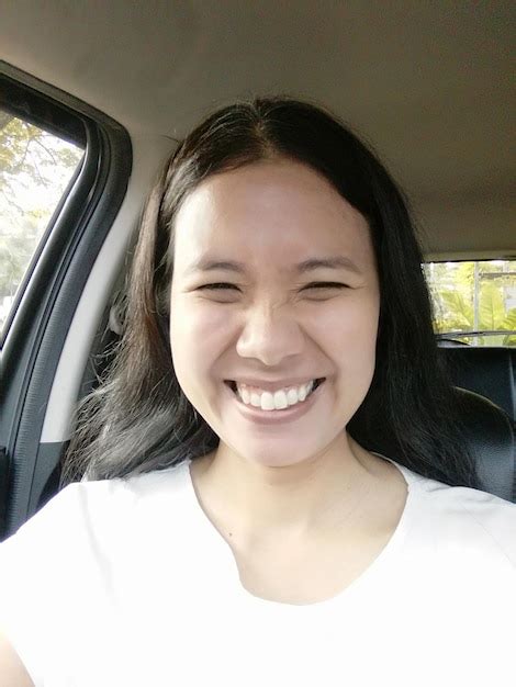 Premium Photo Portrait Of Smiling Mid Adult Woman Sitting In Car