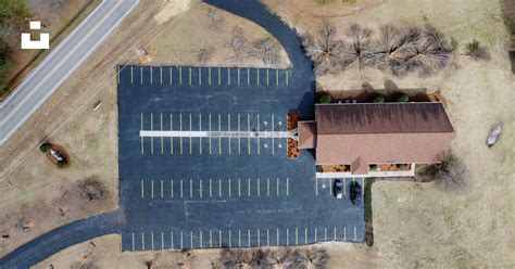 An aerial view of an empty parking lot photo – Free Outdoors Image on ...