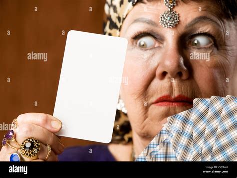 Gypsy fortune teller holding a blank tarot card Stock Photo - Alamy