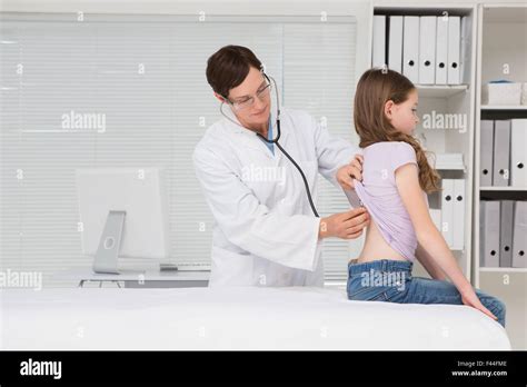 Doctor Examining Little Girl Stock Photo Alamy
